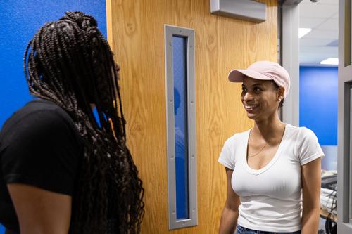 Staff members greet each other